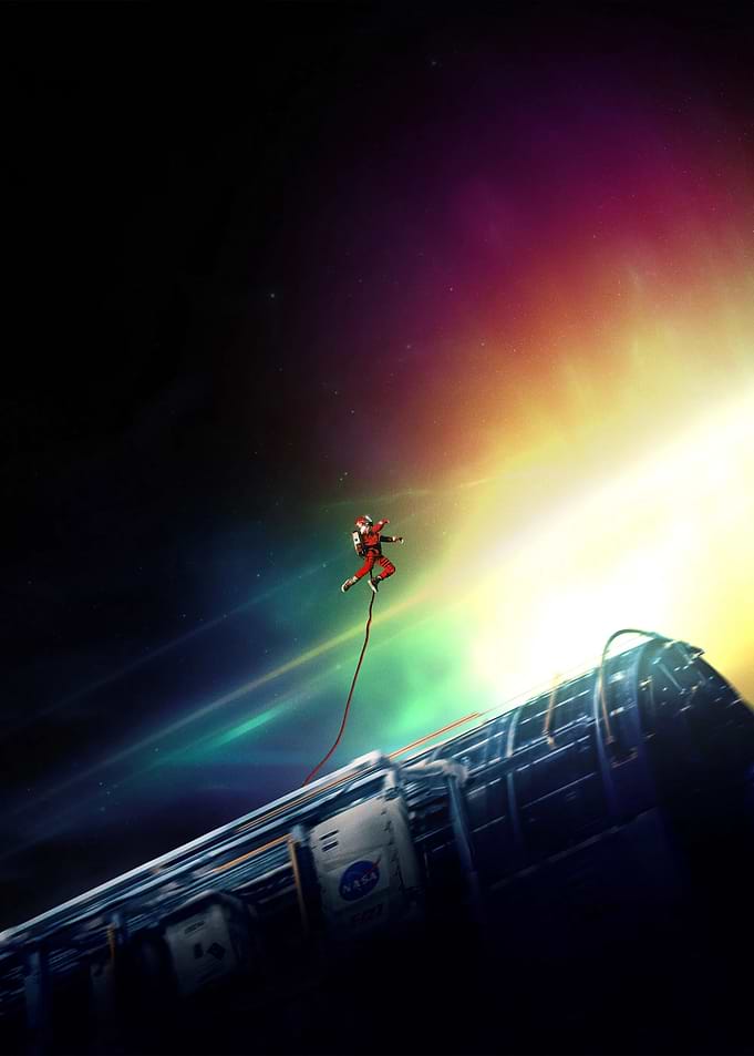 Astronaut tethered to spacecraft in space