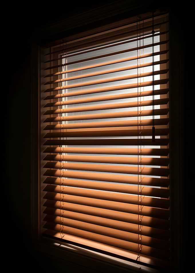 Sunlight through wooden blinds