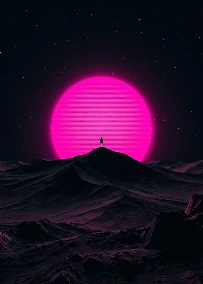 Lone figure on a hill under a pink sun
