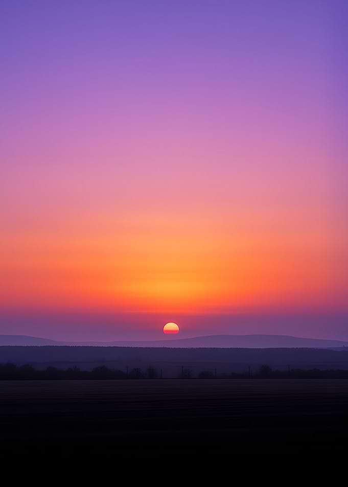 Vibrant Sunset Over Rolling Hills