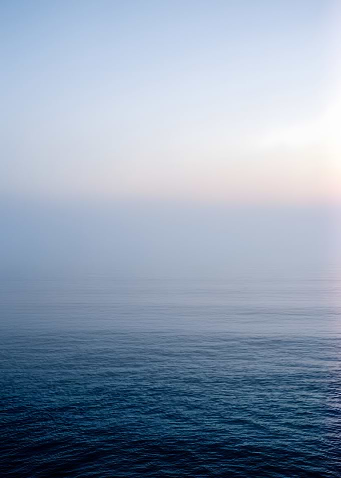 Misty Ocean Horizon at Sunrise