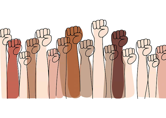 Diverse Fists Raised in Unity