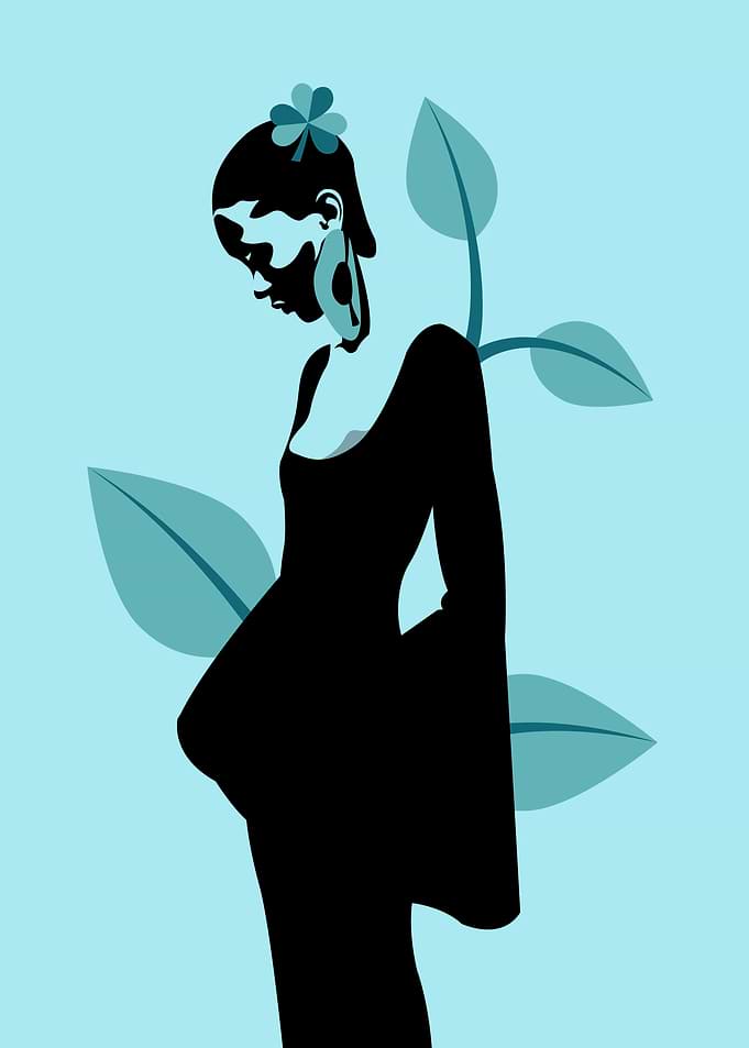 Woman in Black Dress with Floral Hair Accessory