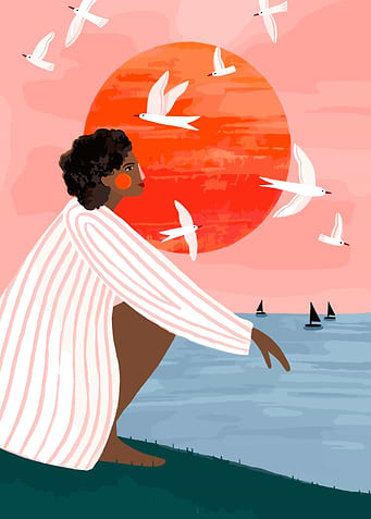 Woman watching birds at sunset