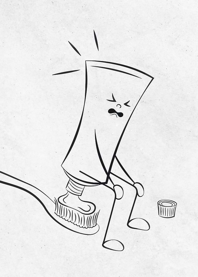 Toothpaste tube in distress on toothbrush