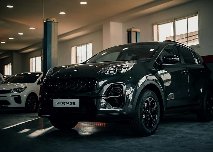 Dark Kia Sportage in Showroom
