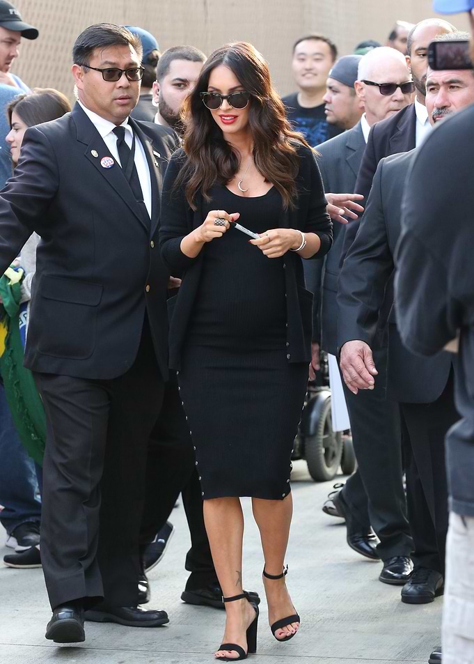 Megan Fox in Black Dress with Security