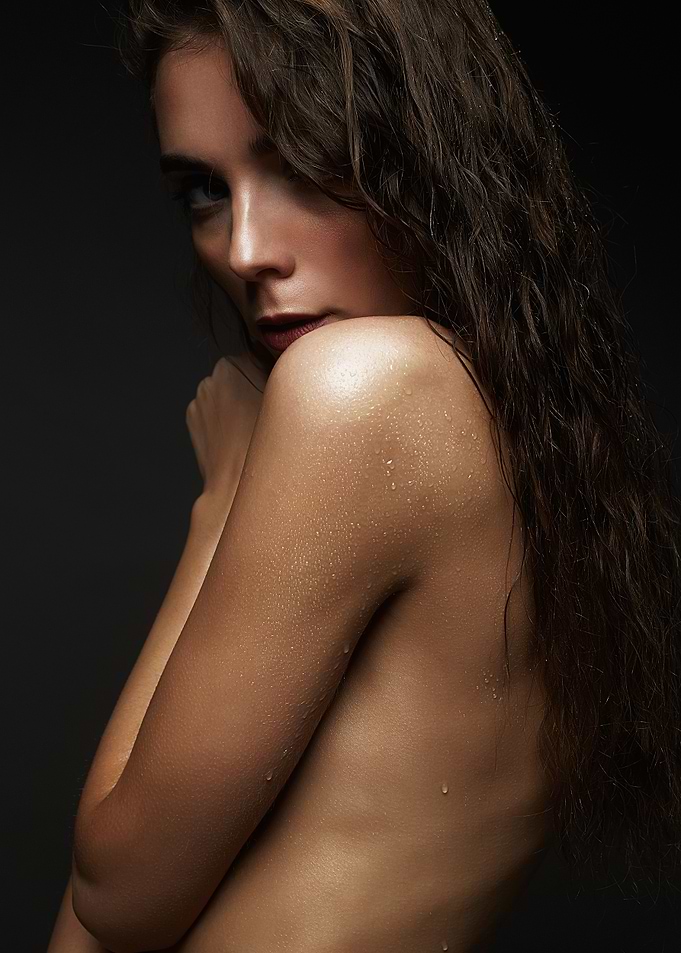 Woman with wet hair and dewy skin