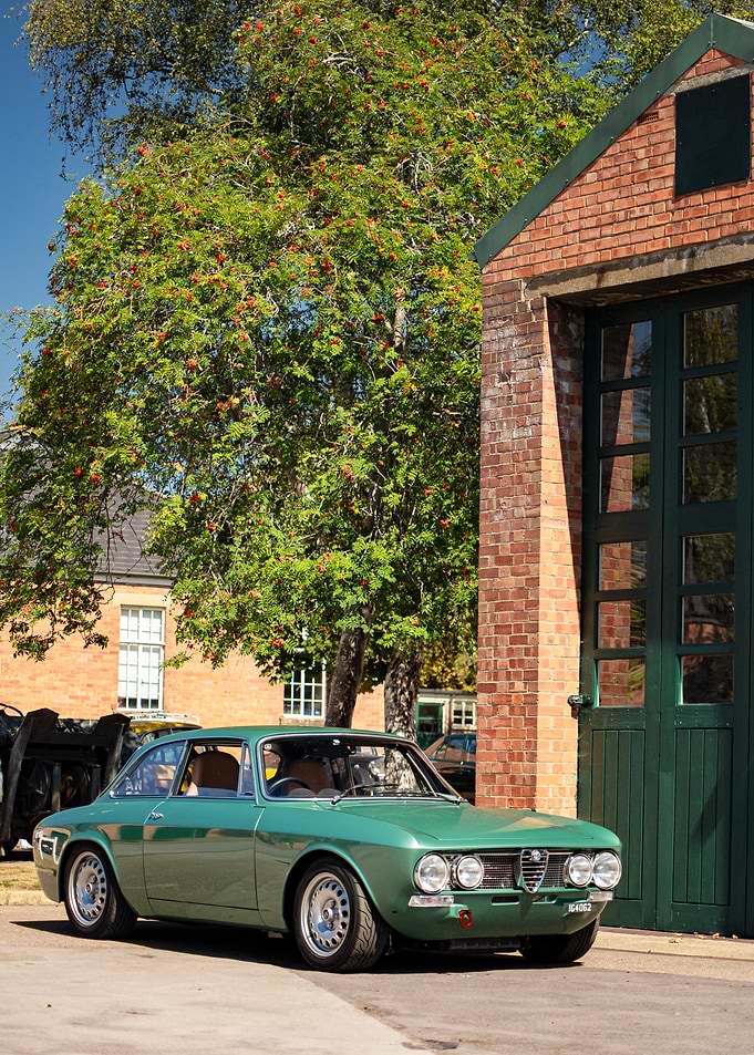 Green Alfa Romeo Coupe by Brick Building