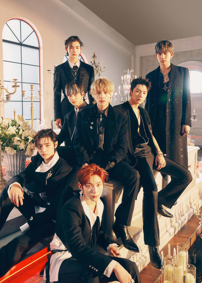 K-pop group in formal black attire