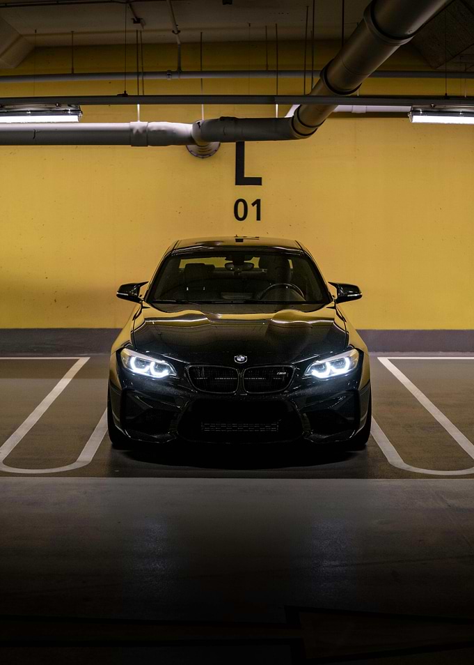 Black BMW M2 in Parking Spot
