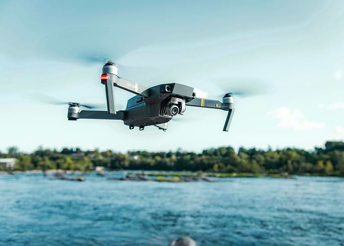 Drone flying over water
