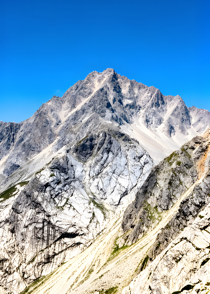 Majestic Mountain Peaks Under Blue Sky