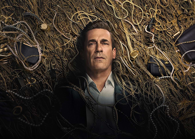 Jon Hamm surrounded by gold chains