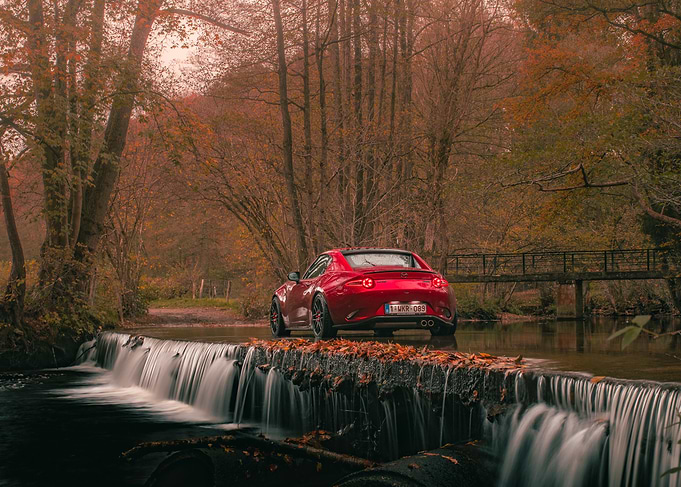 Red Mazda MX-5 on Waterfall