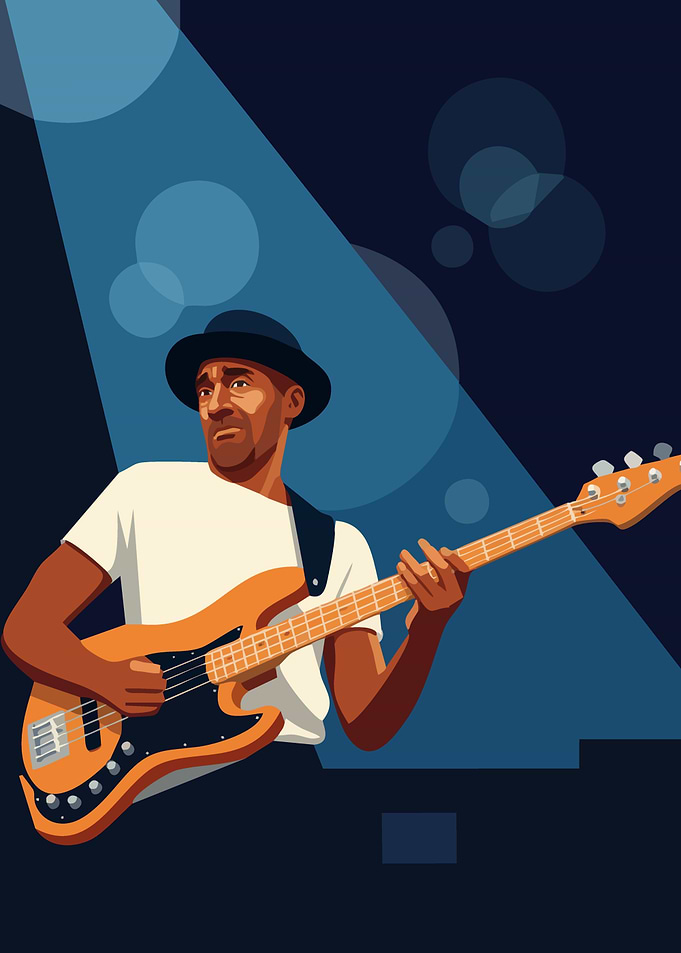 Man playing bass guitar under spotlight