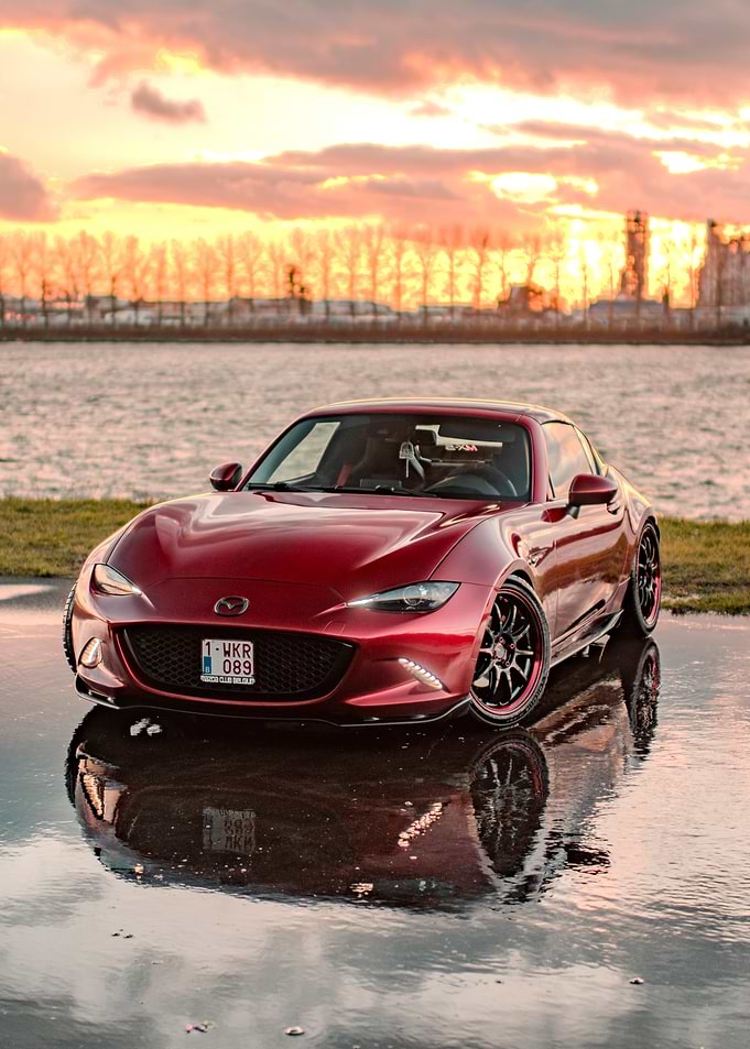Red Mazda MX-5 Miata at Sunset