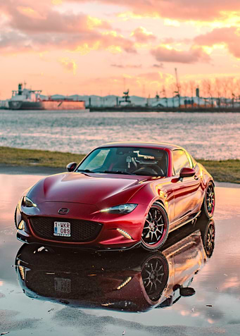 Red Mazda MX-5 Miata at Sunset