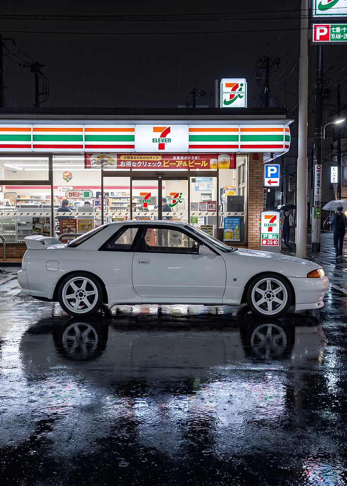 White Nissan Skyline R32 at a rainy 7-Eleven in Japan