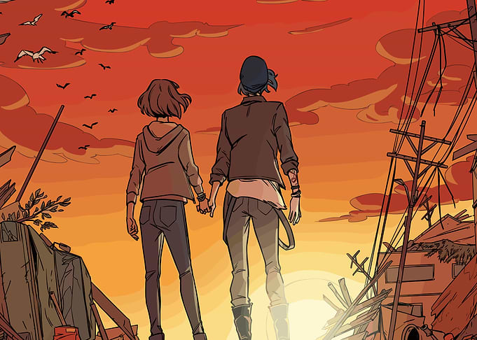 Two girls holding hands at sunset