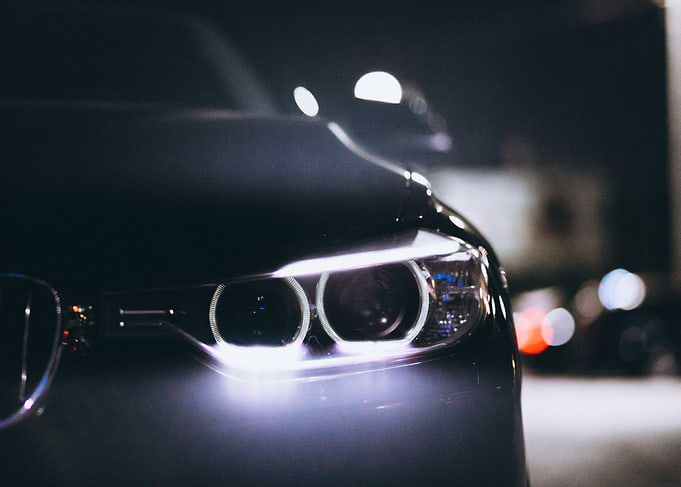 Close-up of a car's headlights at night