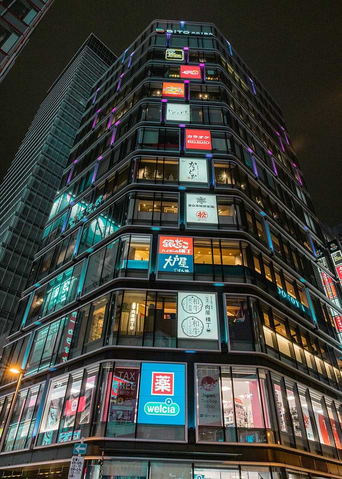 Nighttime Akihabara Building with Neon Signs