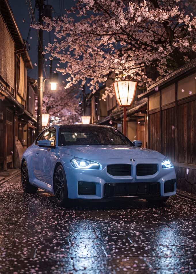 Blue BMW M2 in Cherry Blossom Alley
