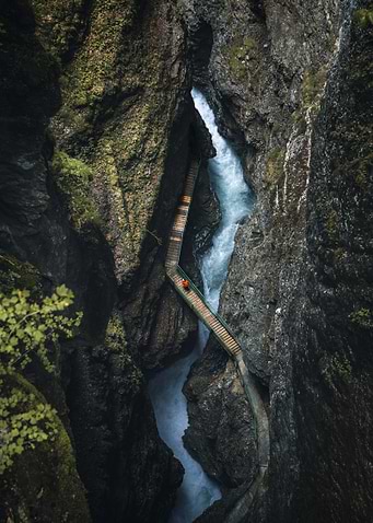 Person on a boardwalk in a gorge