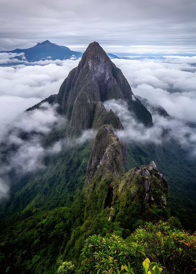 Jagged Mountain Peaks Above Clouds