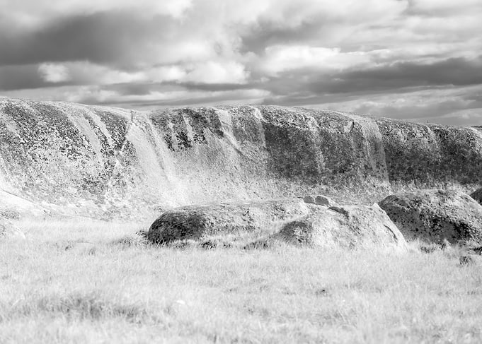 Dramatic Rocky Landscape Under Cloudy Sky
