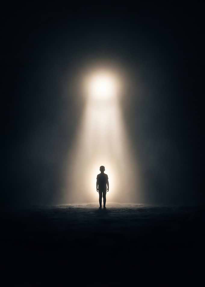 Child in a beam of light