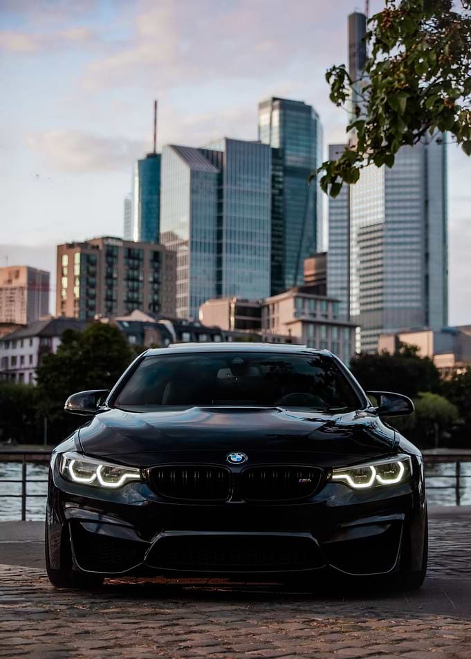 Black BMW M4 in Cityscape