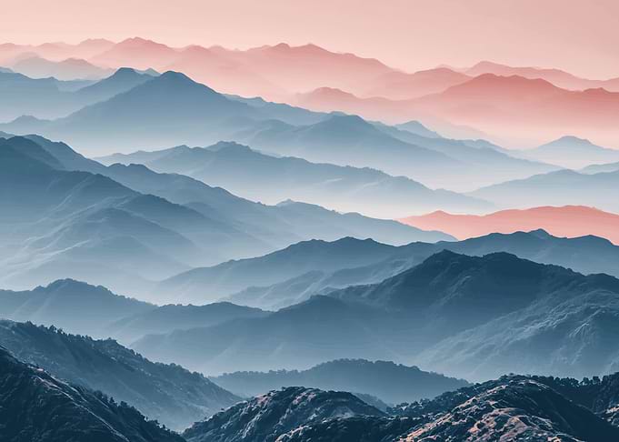 Misty Mountain Range at Sunrise