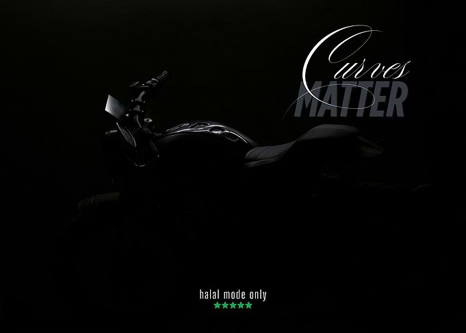 black and white Motorcycle with 'Curves Matter'
