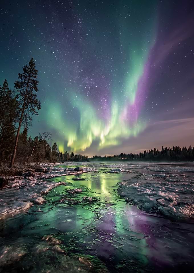 Aurora Borealis over Frozen Landscape