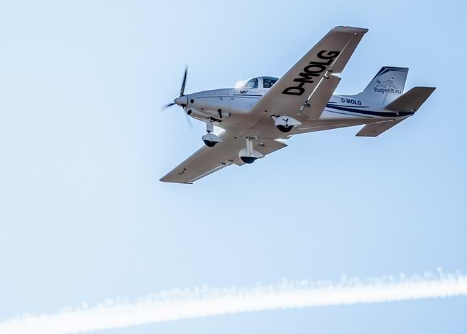 Airplane in flight against blue sky
