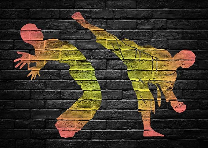 Martial Arts Graffiti on dark Brick Wall