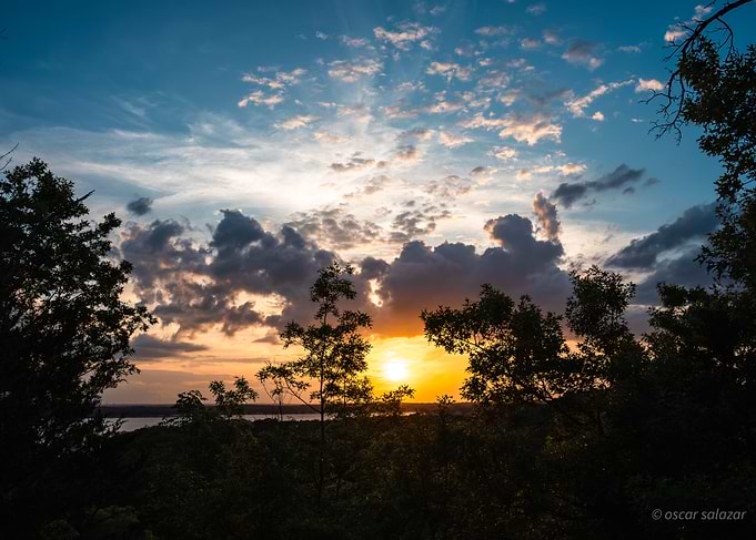 Sunset over a forest and lake
