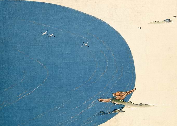 Cranes flying over blue water with boats