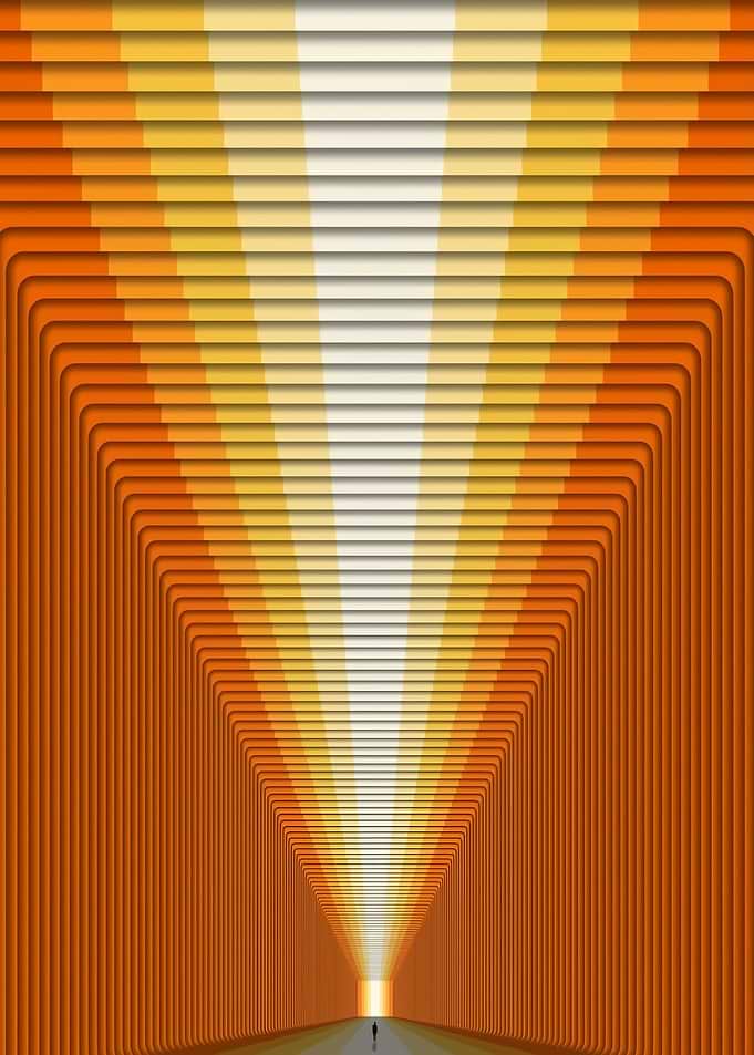 Man walking towards light in abstract tunnel