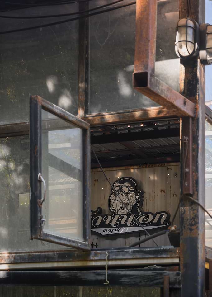 Rusted Window Frame with Biker Graphic