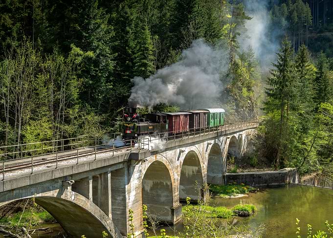 Steam Train Crossing a Viaduct