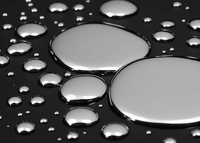 Mercury droplets on a dark surface