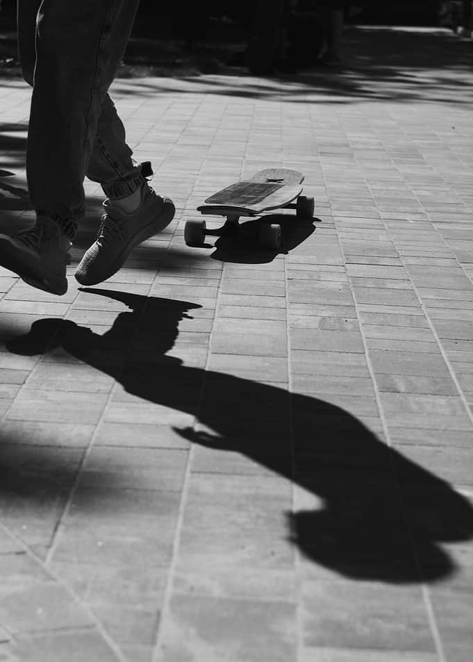 Skateboarder's Shadow on Pavement