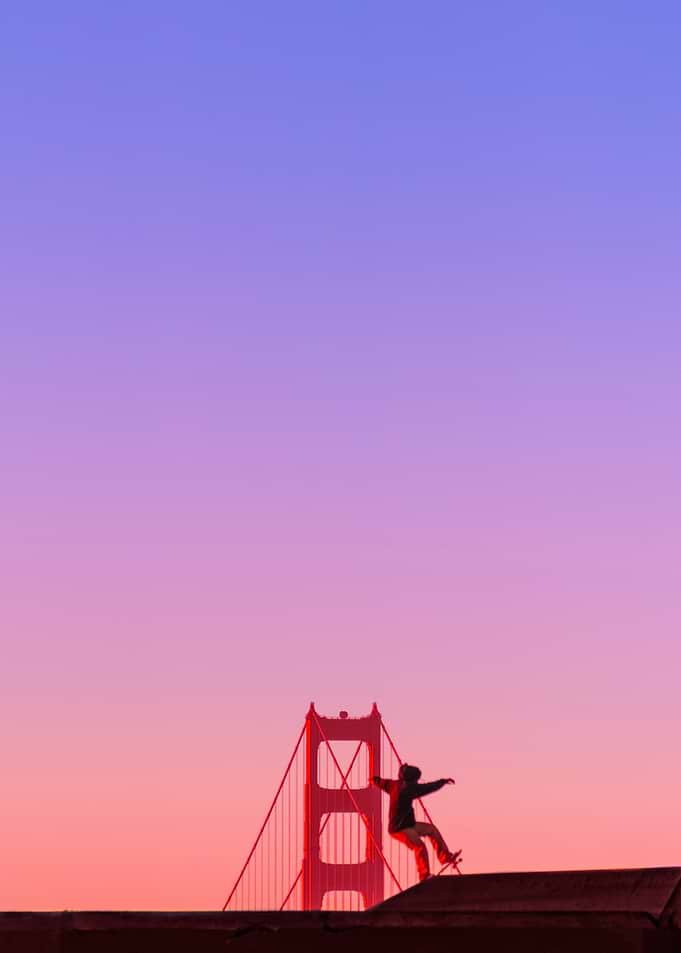 Skateboarder at Golden Gate Bridge Sunset