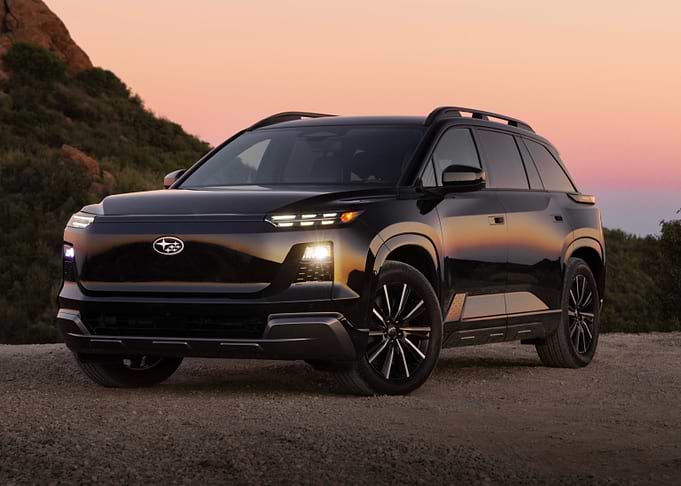 Black Subaru SUV at Sunset