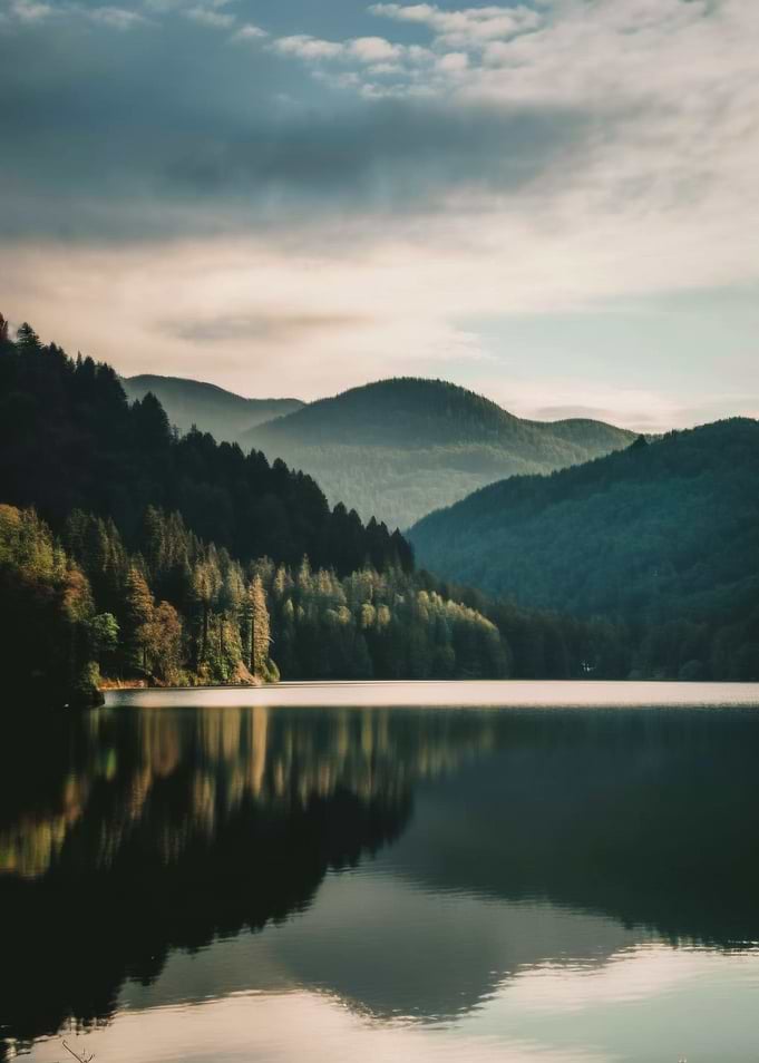 Misty Mountains Reflected in a Serene Lake