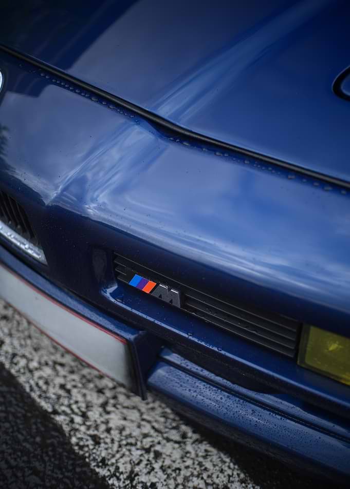 BMW M Emblem on Blue Car