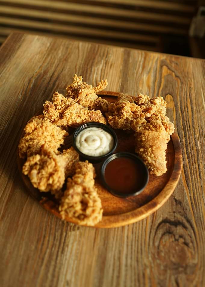 Crispy fried chicken tenders with dipping sauces