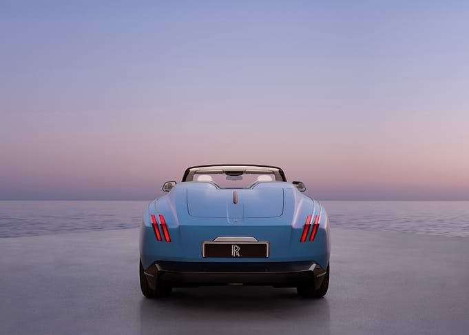 Blue Rolls-Royce convertible by the sea